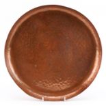 Newlyn, Arts & Crafts beaten copper circular tray, impressed Newlyn, 33.5cm in diameter