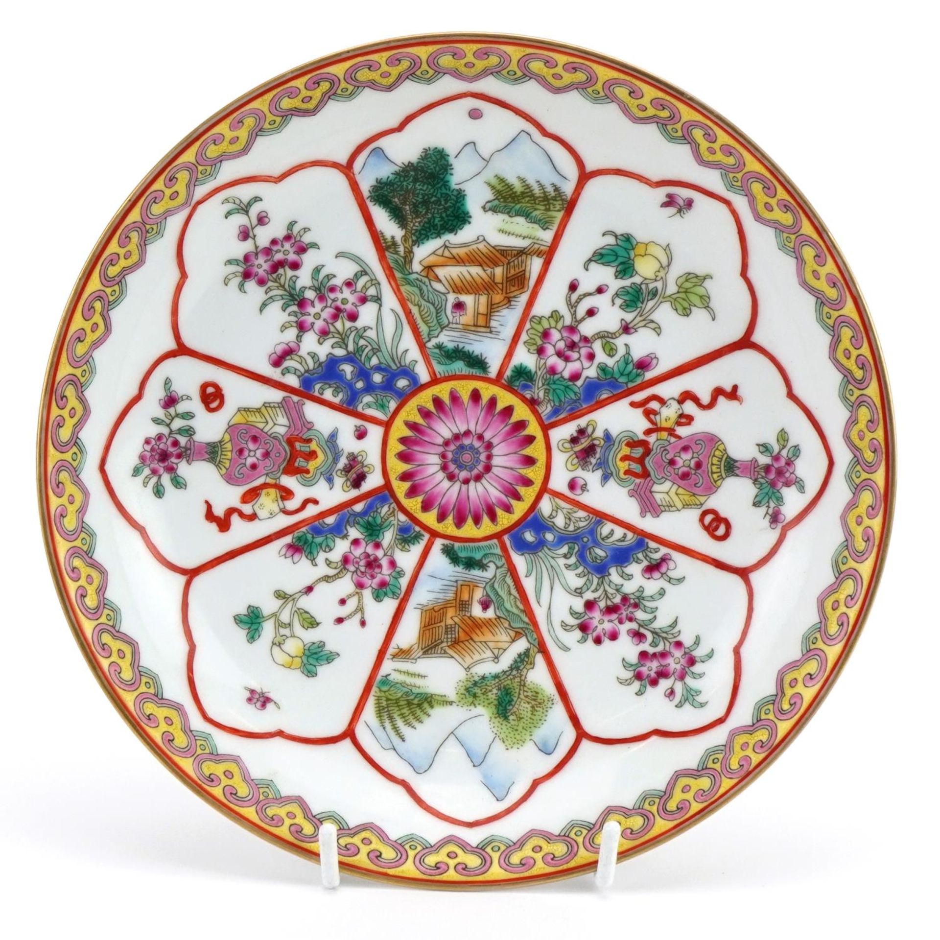 Chinese porcelain shallow dish hand painted in the famille rose palette with landscapes and flowers,