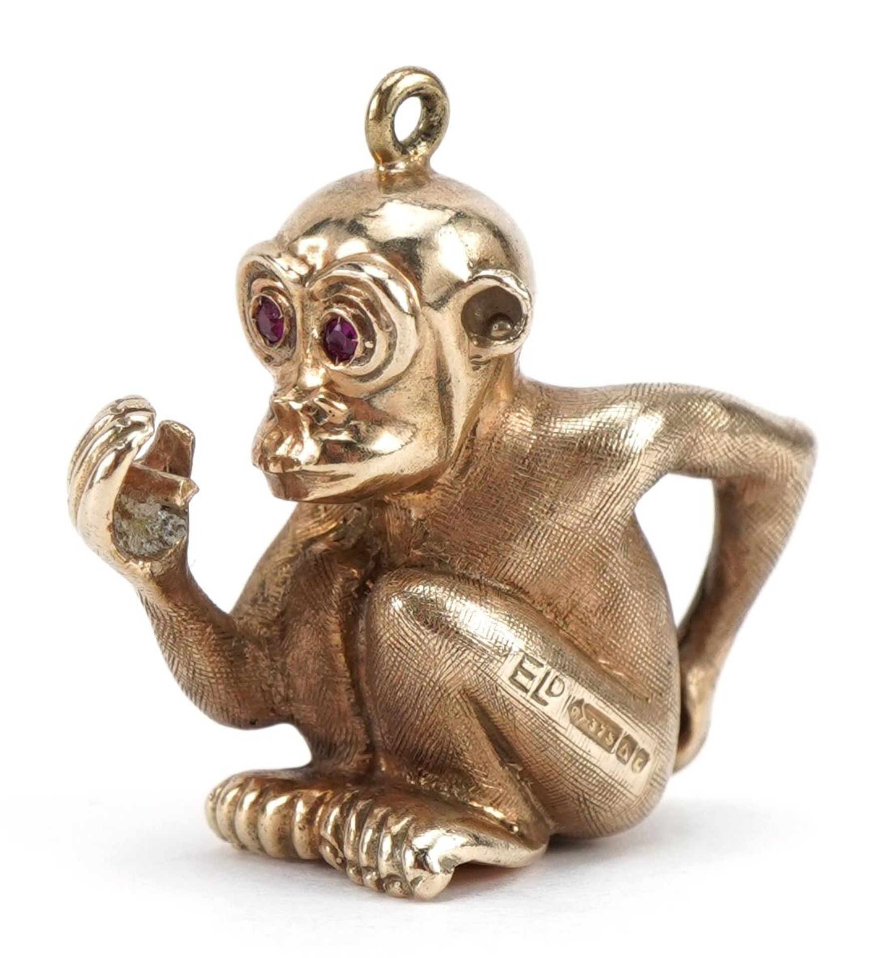 9ct gold monkey pendant with ruby set eyes, 2.3cm high, 6.8g