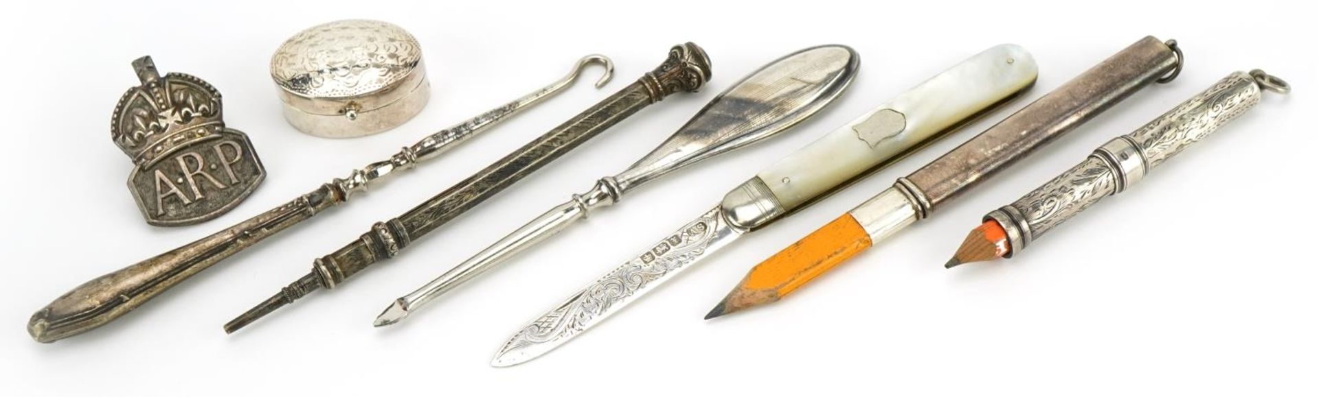 Silver objects including propelling pencils, ARP badge and a silver and mother of pearl folding