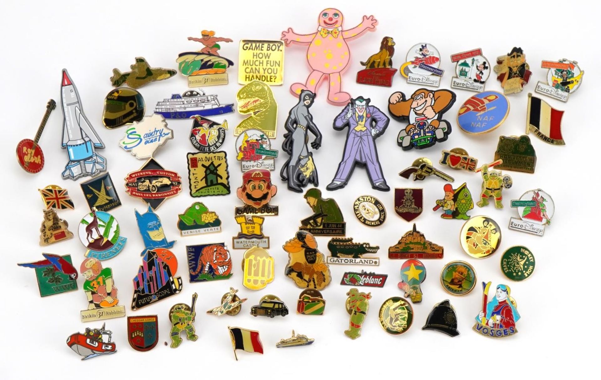 Collection of vintage and later badges, mostly enamelled including Disney Peter Pan, Mr Blobby, Lion