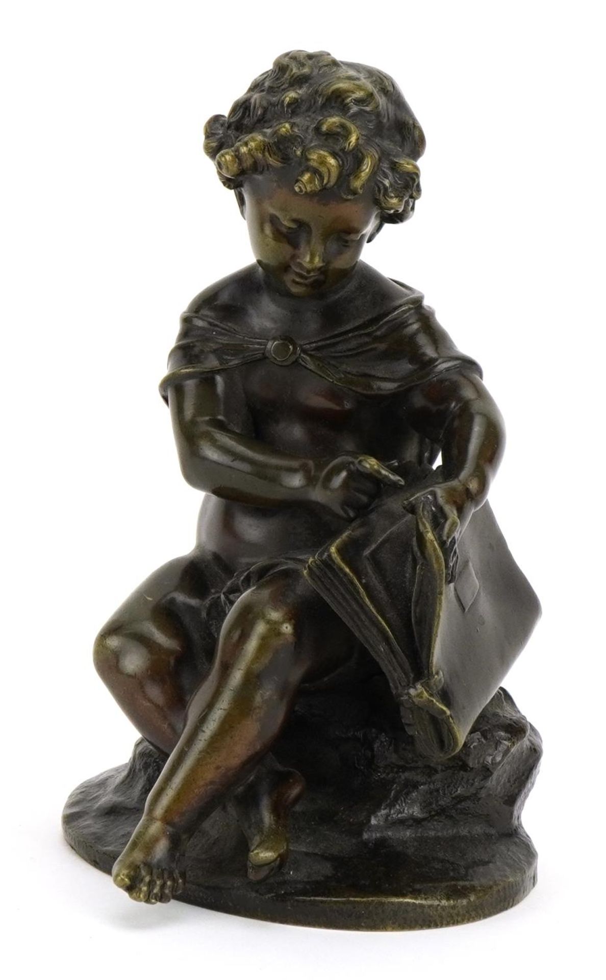 Patinated bronze study of a semi nude young boy with book, 15cm high