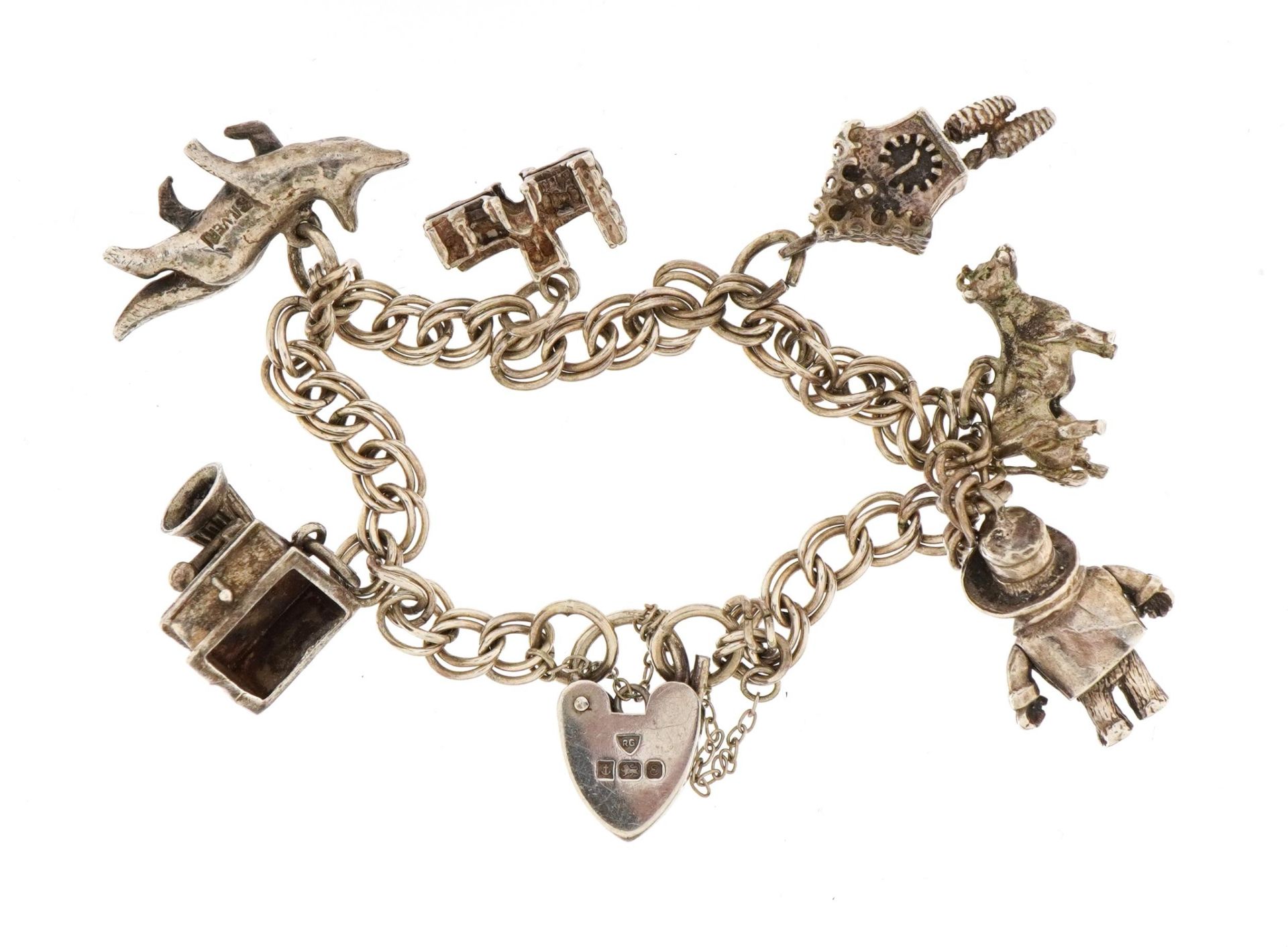 Silver charm bracelet with a selection of mostly silver charms including Paddington Bear with moving - Bild 2 aus 3