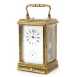 Large brass cased repeating carriage alarm clock engraved with flowers, the enamelled dial with