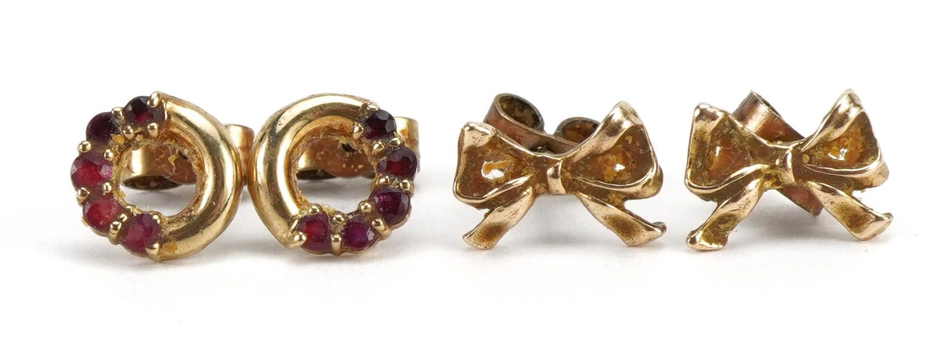 Two pairs of 9ct gold earrings, one set with rubies and bow design studs, the largest 1.0cm wide, - Image 2 of 3