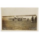 Early 20th century black and white photographic postcard of an aeroplane at Bexhill April 1914