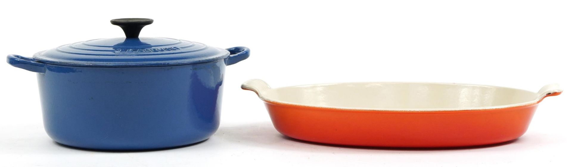 Blue Le Creuset cast iron casserole pot and cover and an oval dish, the largest 42cm wide