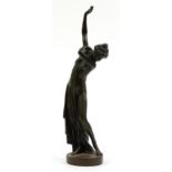 Patinated bronze study of a semi nude Art Deco female dressing, 48cm high