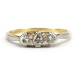 18ct gold and platinum diamond three stone ring, the central diamond approximately 2.6mm in