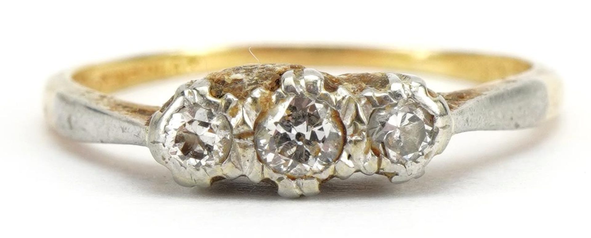 18ct gold and platinum diamond three stone ring, the central diamond approximately 2.6mm in