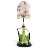 Art Deco porcelain female dancer table lamp with pink and white mottled glass shade, 48cm high