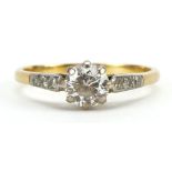 18ct gold diamond solitaire ring with diamond set shoulders, the diamond solitaire approximately 0.