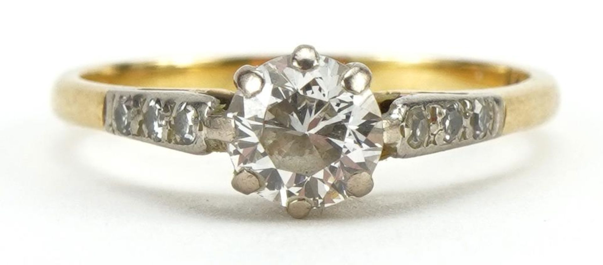 18ct gold diamond solitaire ring with diamond set shoulders, the diamond solitaire approximately 0.