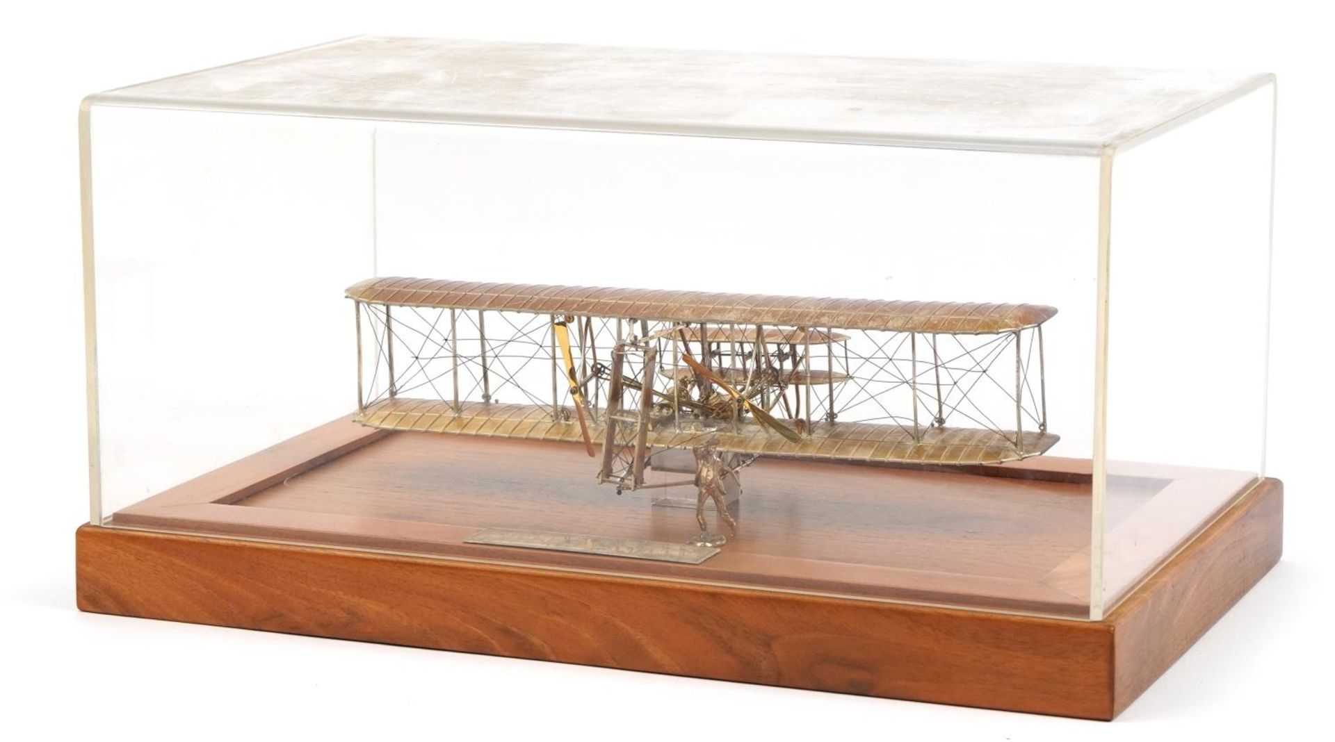 Sterling silver model of The Wright Brothers Flyer housed in a display case, the plaque engraved A