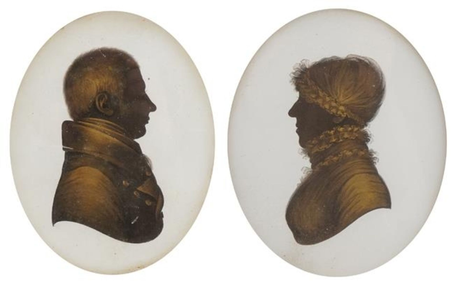 Pair of oval hand painted silhouettes of a lady and gentleman, the female inscribed Mrs Williams
