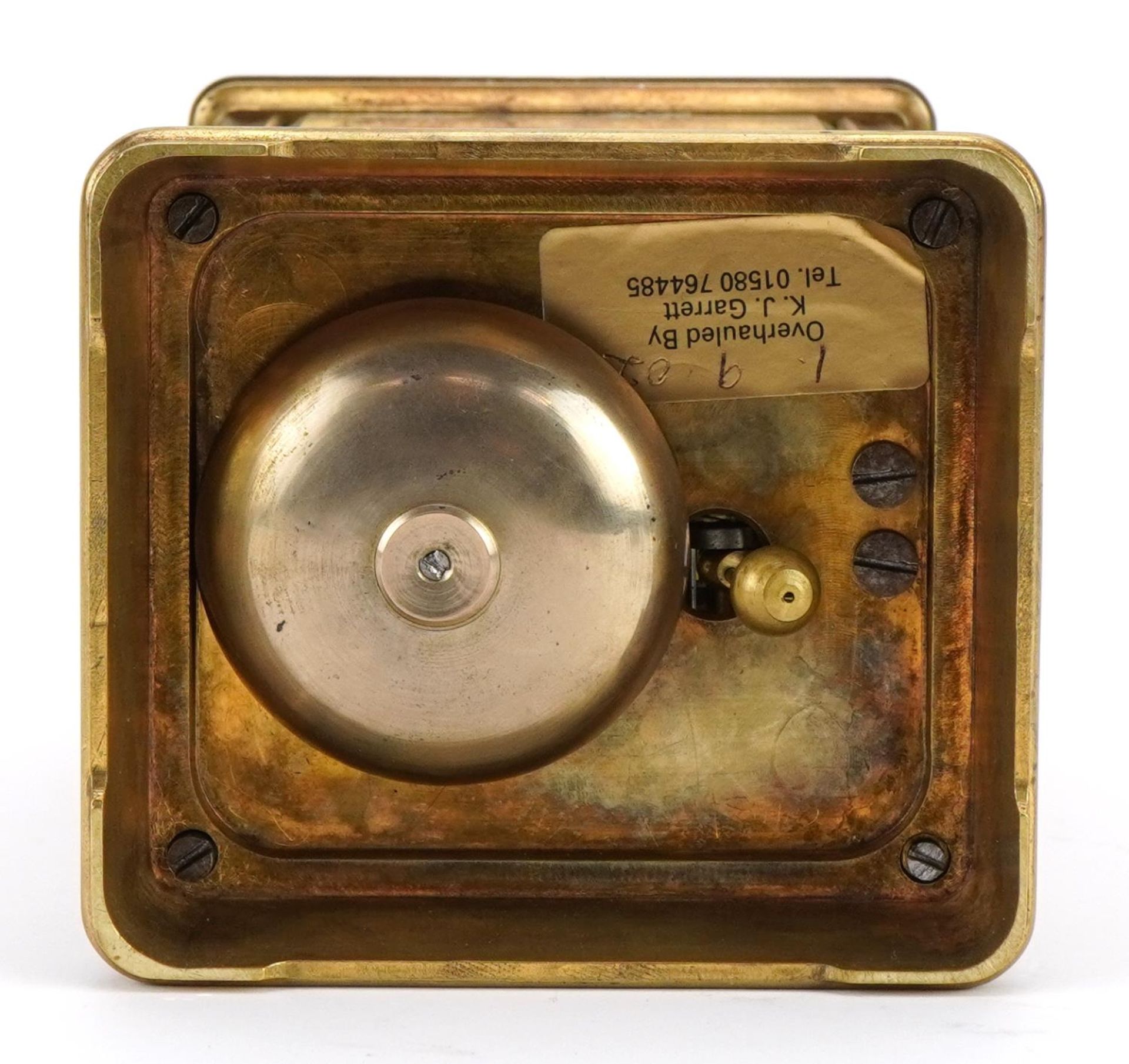Large brass cased repeating carriage alarm clock engraved with flowers, the enamelled dial with - Image 5 of 5