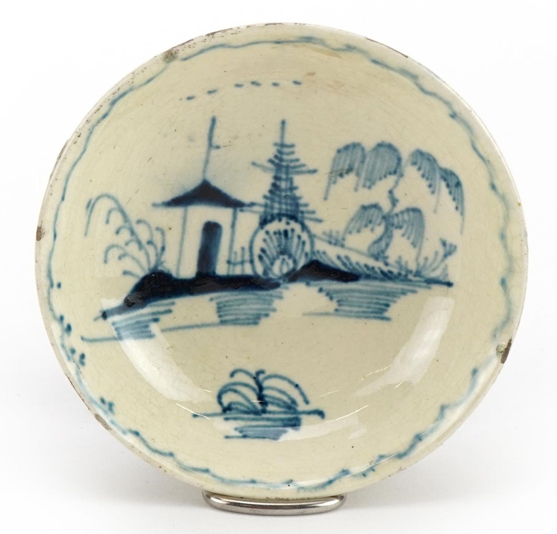 Early 19th century pearlware dish hand painted in the chinoiserie manner, 7.5cm in diameter