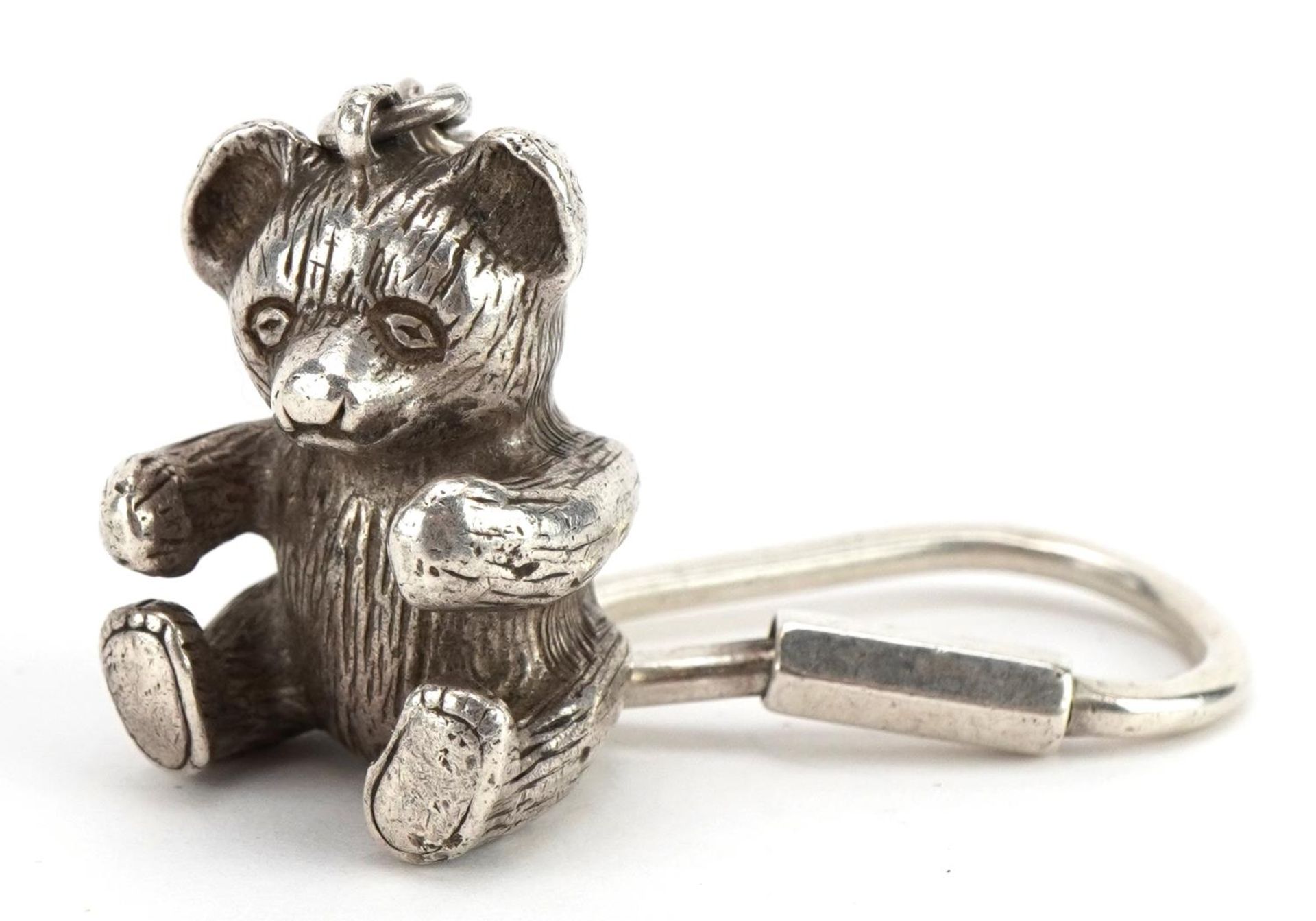 Novelty silver teddy bear keyring, indistinct marks, 9cm in length, 22.3g