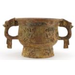 Chinese patinated bronze archaic style censer with twin handles, character marks to the interior,