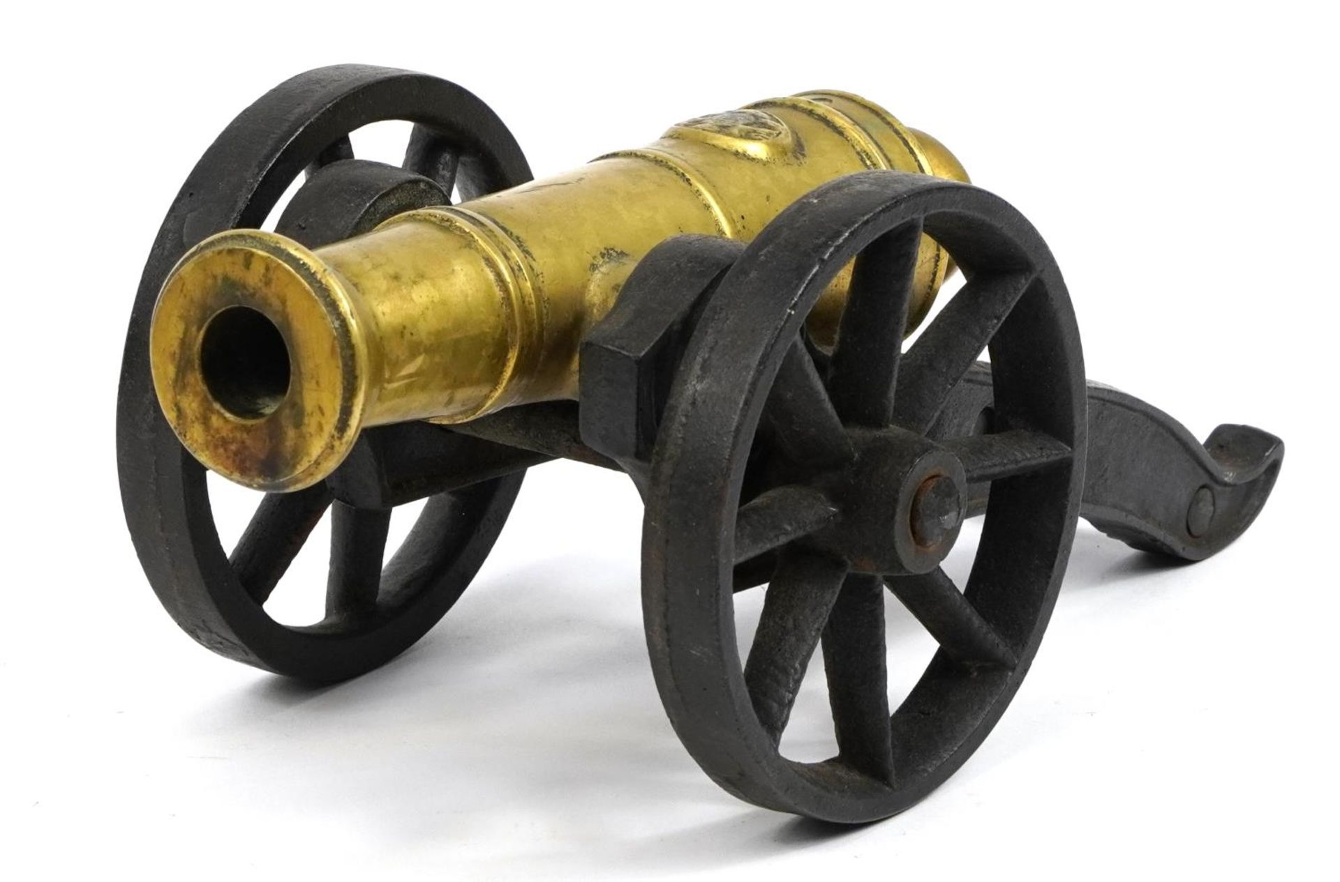 Gilt bronze and cast iron model table cannon, 33cm in length