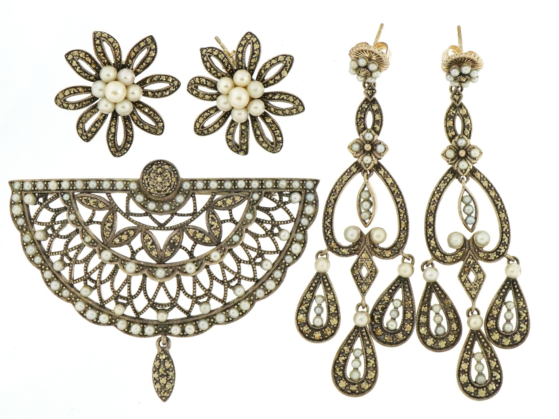 Silver marcasite and pearl brooch with matching earrings and a pair of similar earrings, the largest