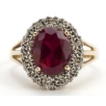 9ct gold red stone and diamond three tier cluster ring with split shoulders, tests as ruby, the