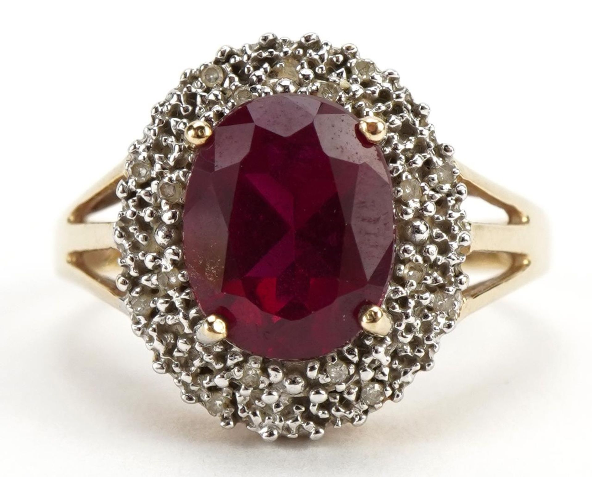 9ct gold red stone and diamond three tier cluster ring with split shoulders, tests as ruby, the