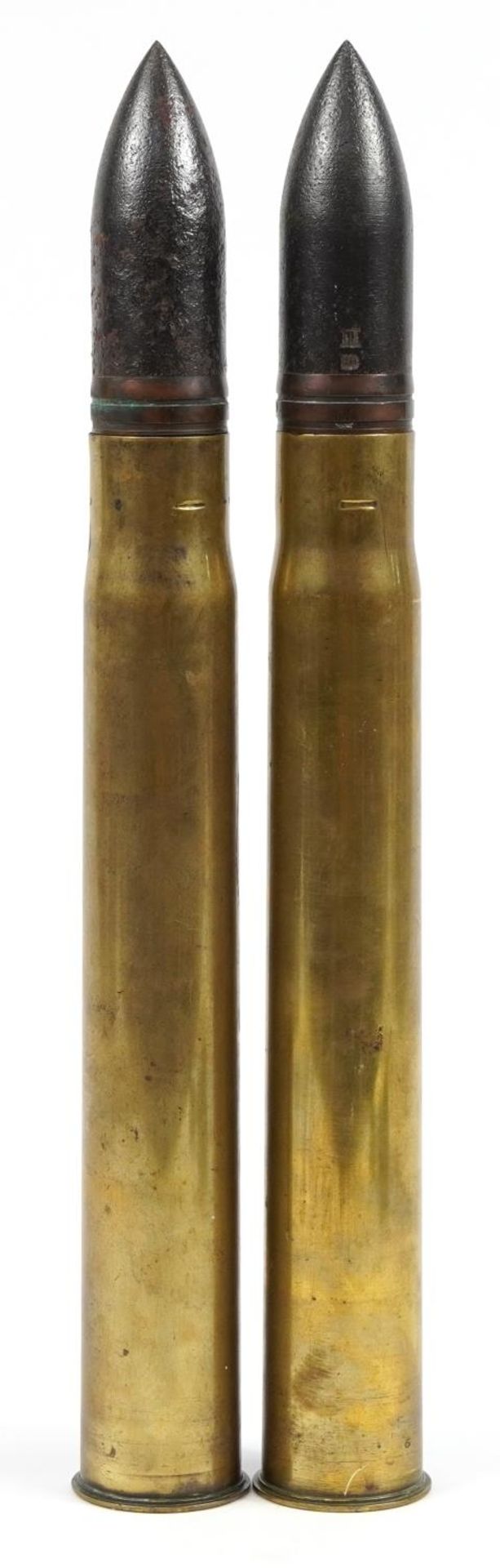 Pair of British military interest ammunition shells with heads, each with impressed marks, 51.5cm
