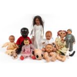 Eight vintage composite and cloth dolls with jointed limbs and two miniature bisque baby dolls,