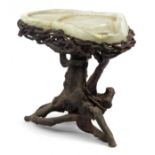 Chinese fluorite specimen tea table raised on a gnarled root base, 50cm H x 53cm W x 40cm D