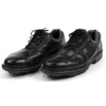 Pair of Foot Joy black leather golf shoes, size 8, housed in a Nike golf shoe bag