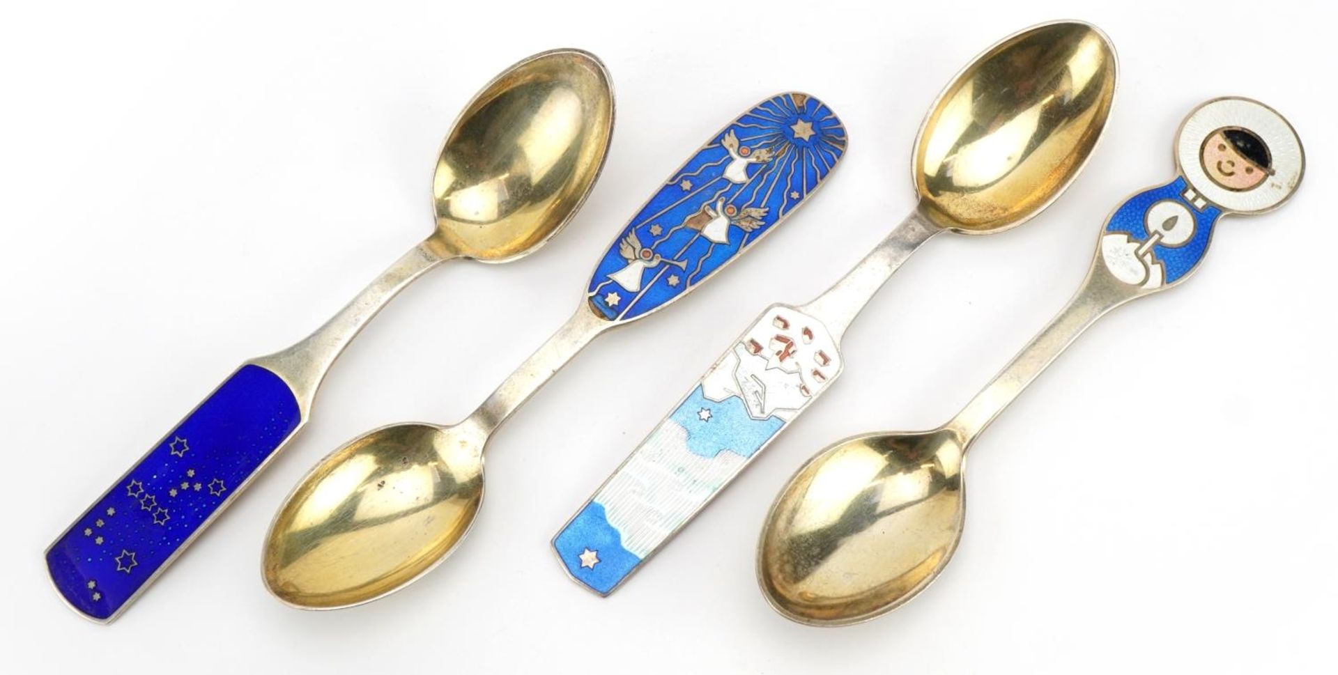 A. Michelsen, set of four Danish silver gilt and enamel Christmas spoons, 16cm in length, 185.2g