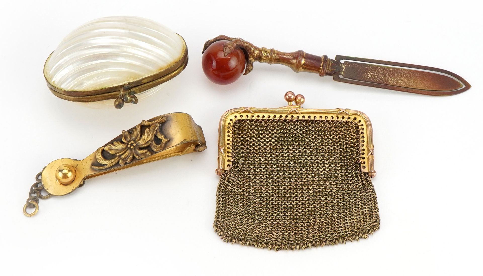 Victorian brass and hardstone claw bookmark, small gilt metal purse, shell purse and gilt metal