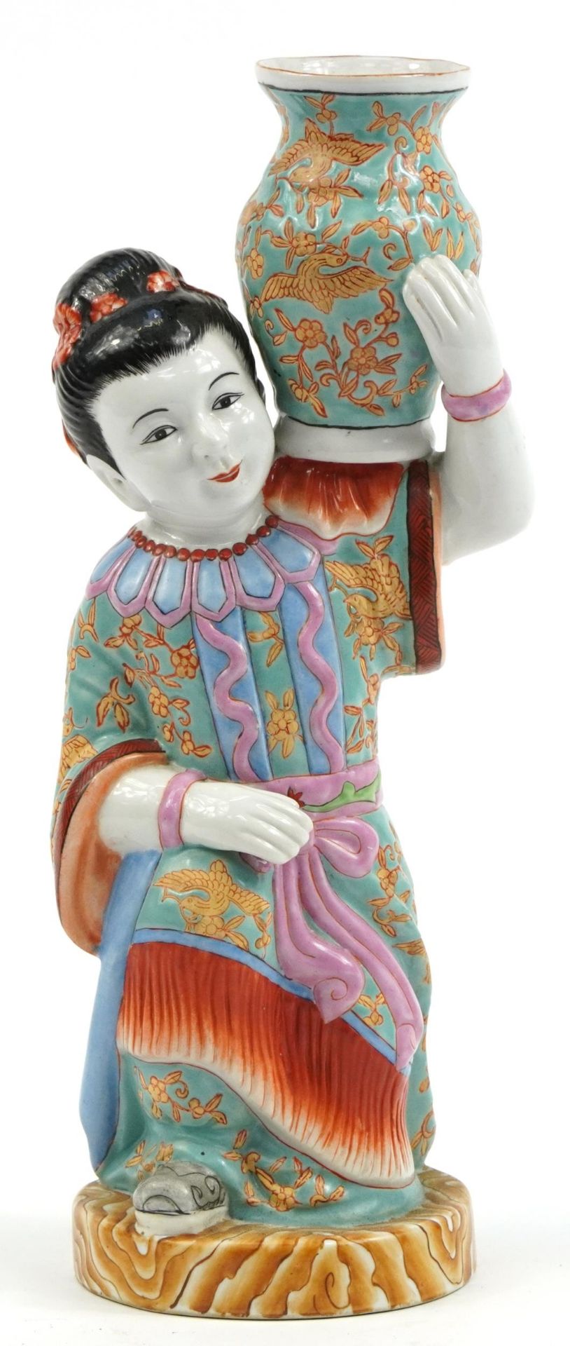 Chinese porcelain vase in the form of a young girl wearing a robe and holding a vase, 38cm high