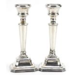 John Bull Ltd, matched pair of Elizabeth II silver square base candlesticks, Birmingham 1997 and