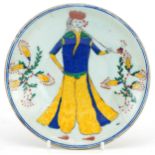 Turkish Ottoman Iznik pottery dish hand painted with a figure in traditional dress and flowers, 15cm
