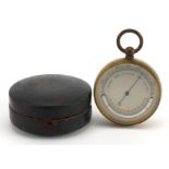 19th century gilt brass compensated pocket barometer with silvered dial and leather case, 5.5cm high
