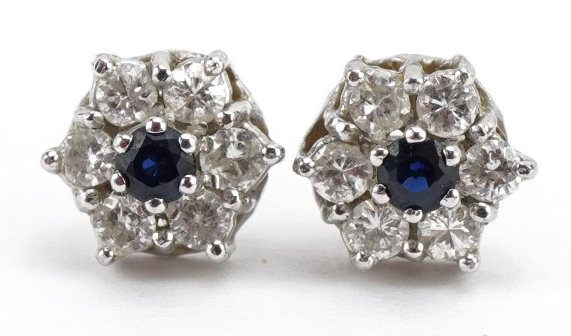 Pair of 18ct white gold sapphire and diamond cluster stud earrings, 9mm in diameter, 2.3g