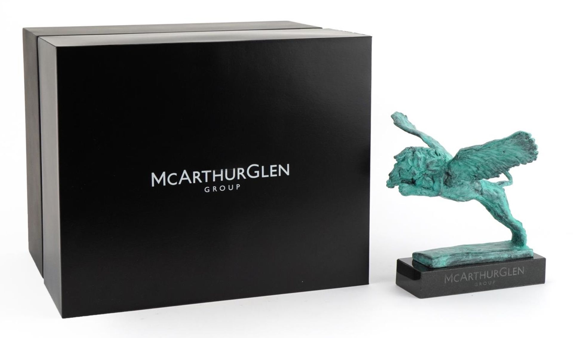 Mark Coreth for McArthur Glen Group, verdigris bronze study of a winged lion raised on a slate