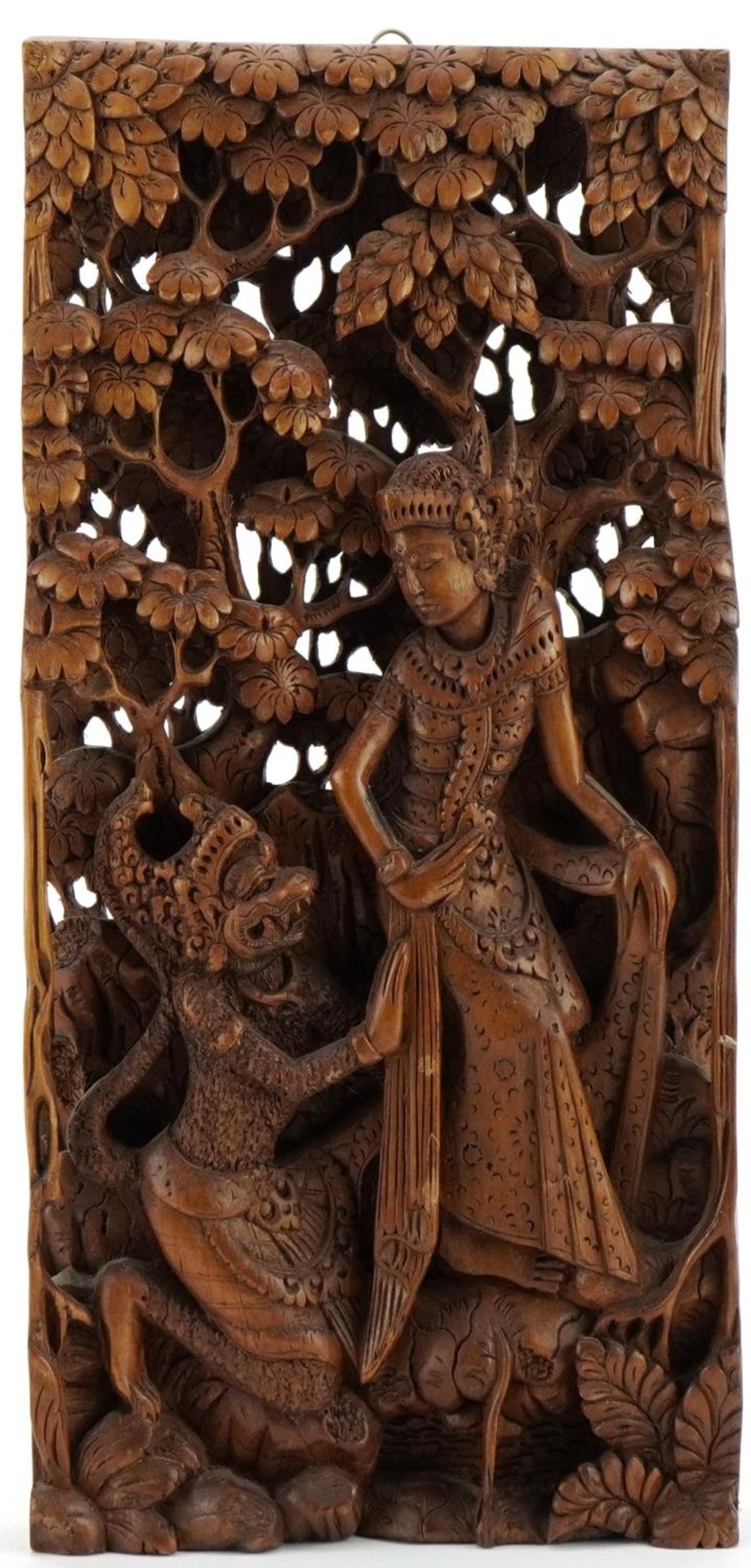 Balinese wooden wall plaque deeply carved in relief with a female and mythical animal, 40.5cm x 19cm