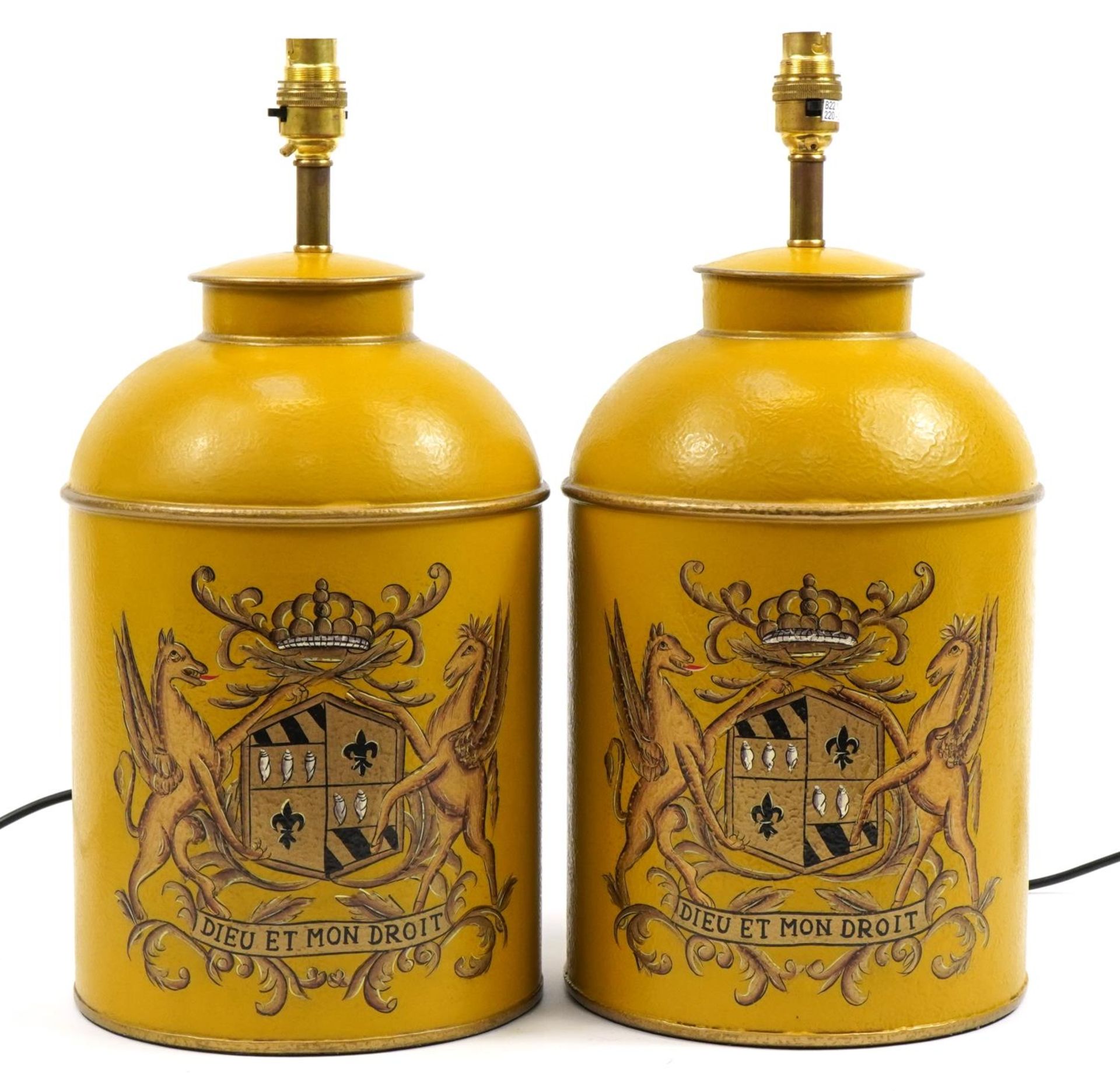 Pair of Toleware metal lamps, each hand painted with heraldic crests, each 45cm high including