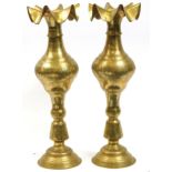 Pair of Indian floor standing brass vases with frilled rims engraved with flowers, each 76.5cm high
