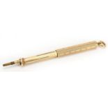 S Mordan & Co, unmarked gold propelling fountain pen and pencil with engine turned decoration,