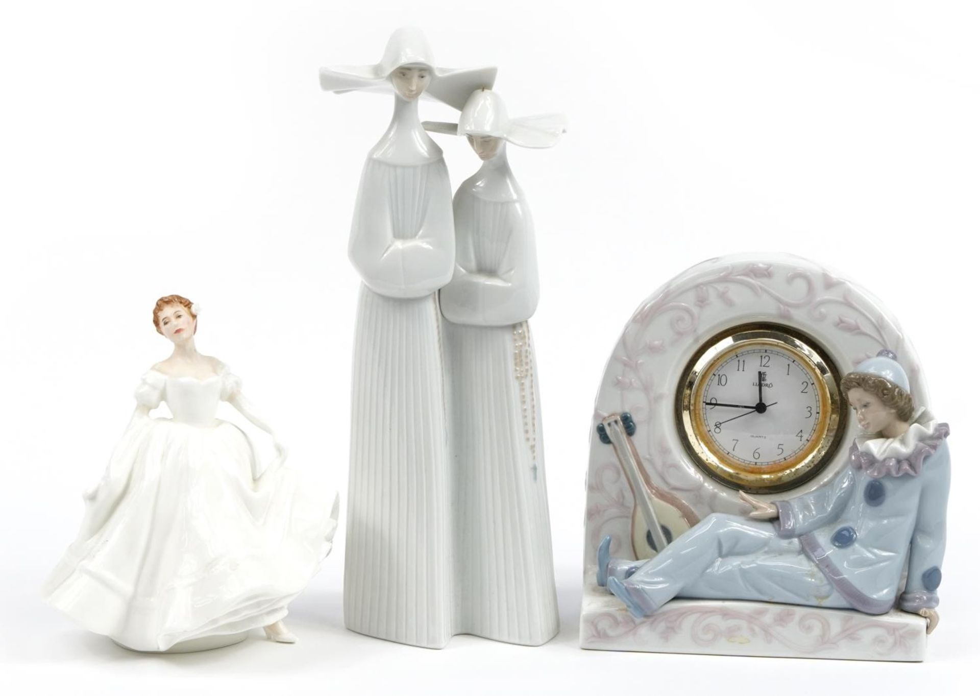 Collectable porcelain figurines comprising Lladro Pierrot clock, Lladro figure group of two nuns and