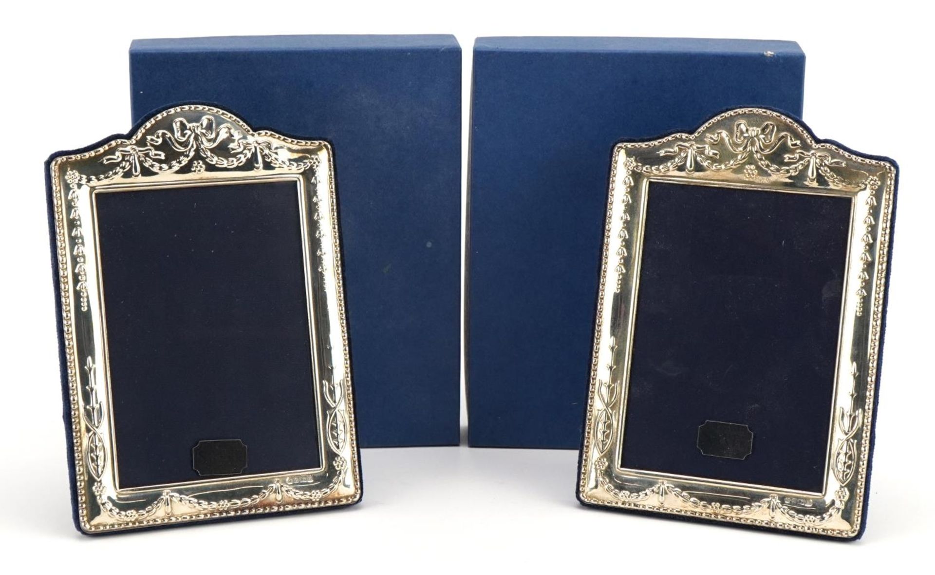 Carr's of Sheffield, pair of silver easel photo frames embossed with swags, each Chester 1997,