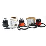 Three Henry style vacuum cleaners