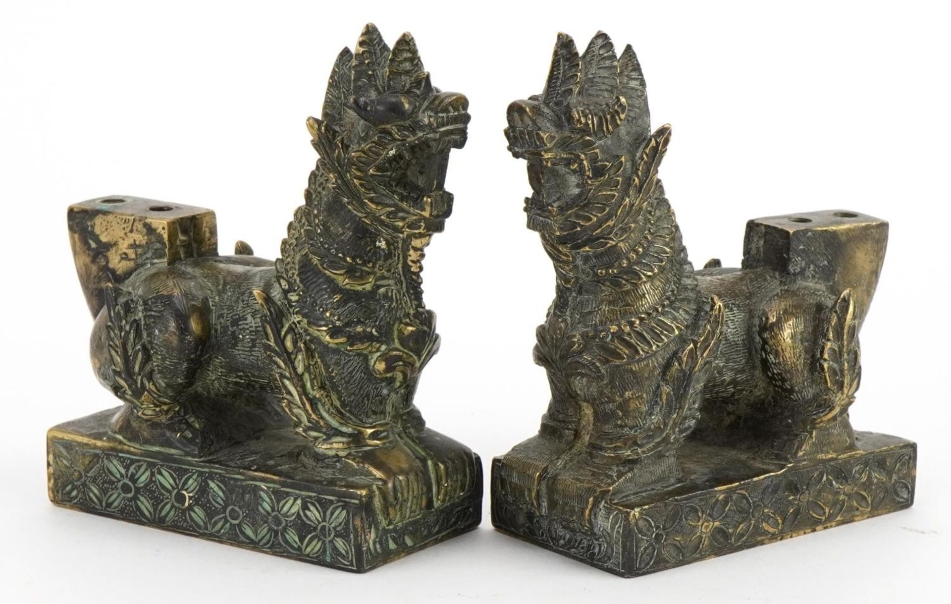 Pair of Chinese patinated bronze guardian dogs, 9.4cm in length