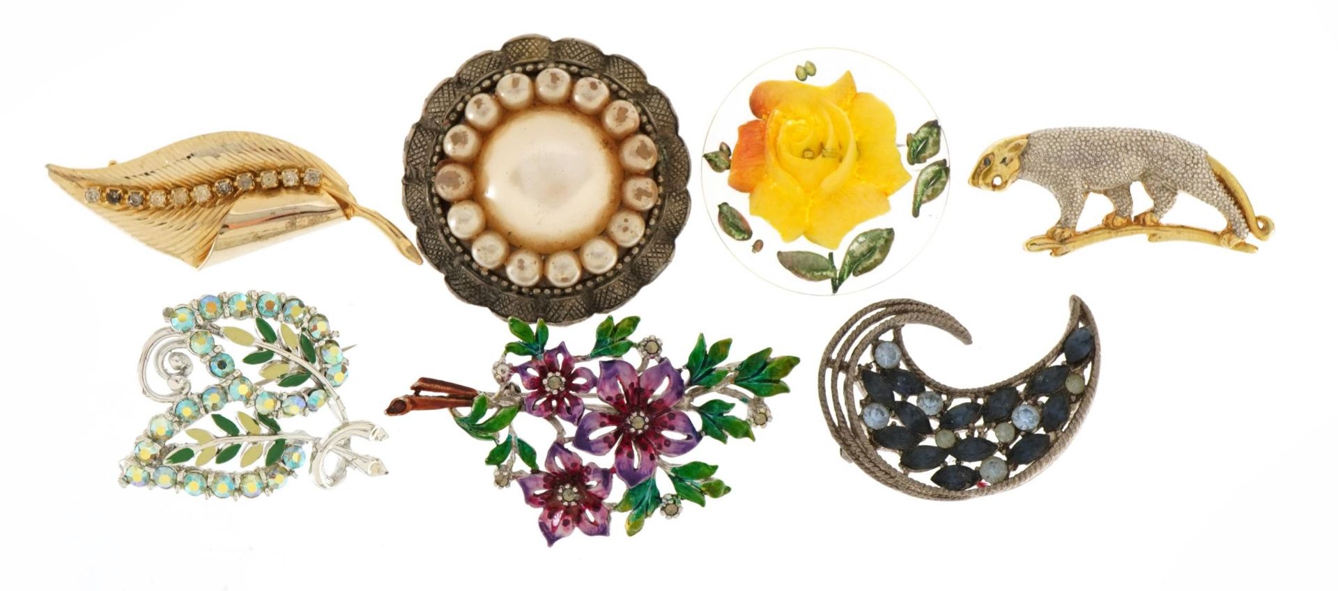 Seven vintage costume jewellery brooches including plastic rose and a leopard, the largest 7cm wide