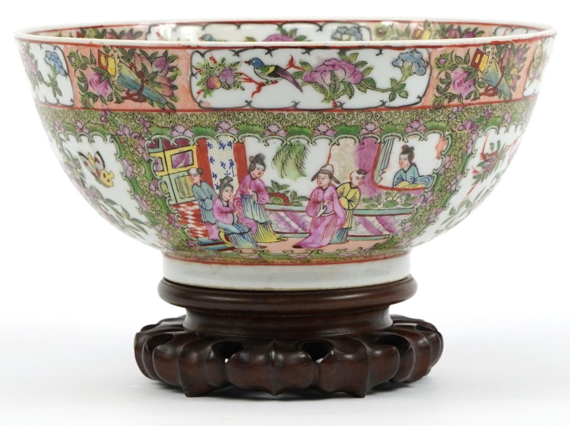 Chinese Canton porcelain bowl raised on hardwood stand hand painted in the famille rose palette with