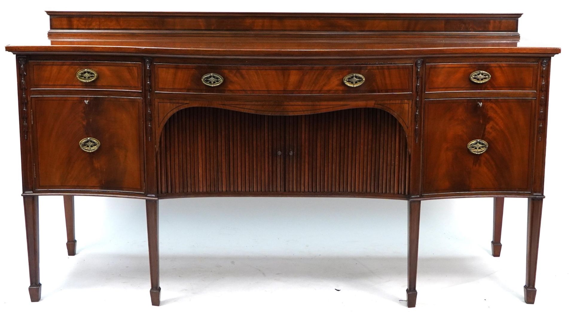 Inlaid mahogany serpentine front sideboard with tambour doors, cupboard doors and drawers raised